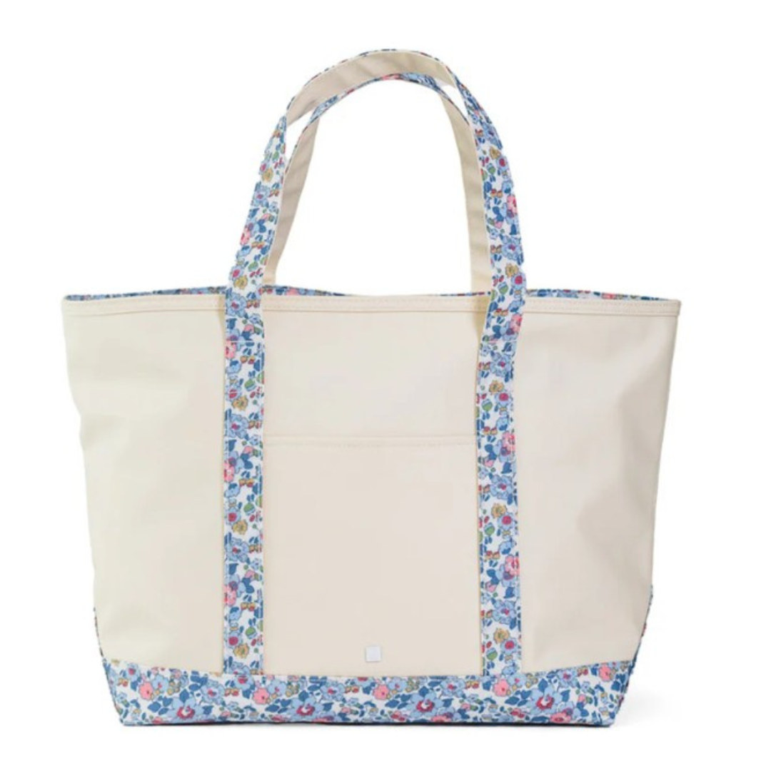Beige tote bag with floral trim on a white background