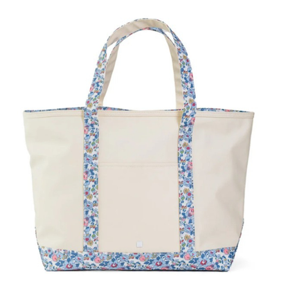 Beige tote bag with floral trim on a white background