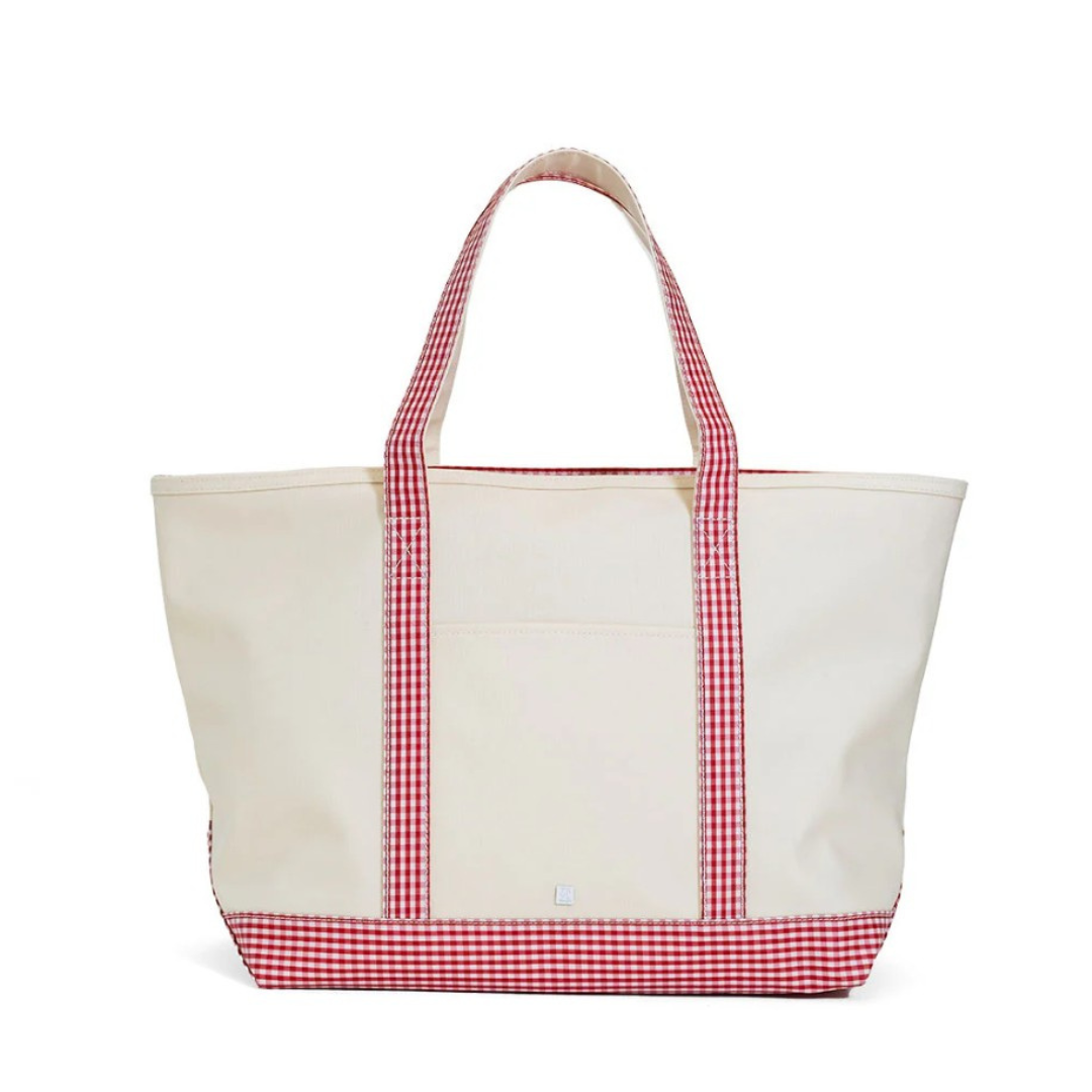 White tote bag with red gingham trim on a white background