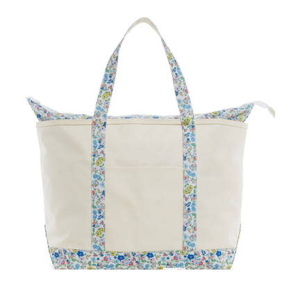 Beige tote bag with floral trim on a white background