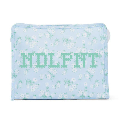 Floral-patterned pouch with 'NDLPNT' text on a light blue background