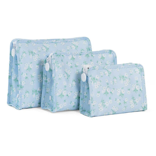 Set of three floral-patterned pouches on a white background
