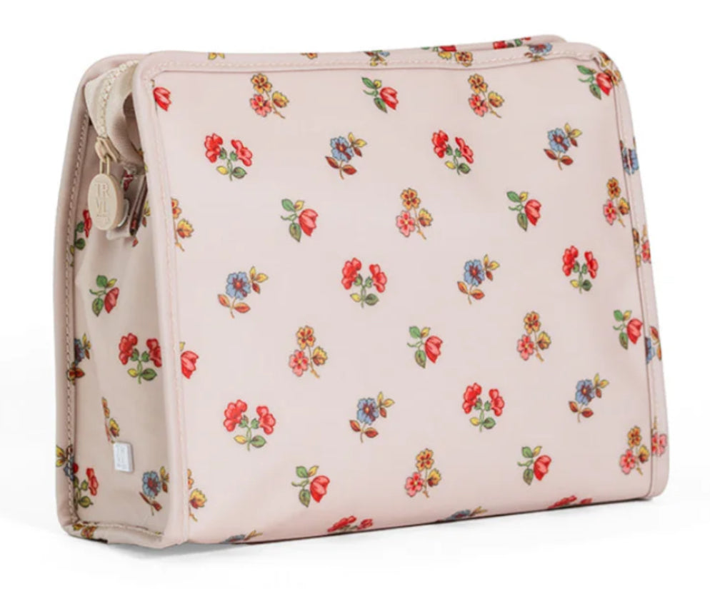 Floral-patterned toiletry bag on a white background