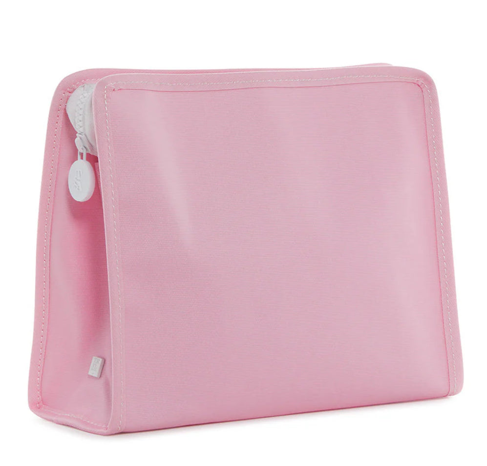 Pink toiletry bag with a white zipper on a white background