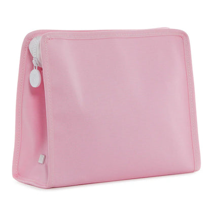 Pink toiletry bag with a white zipper on a white background