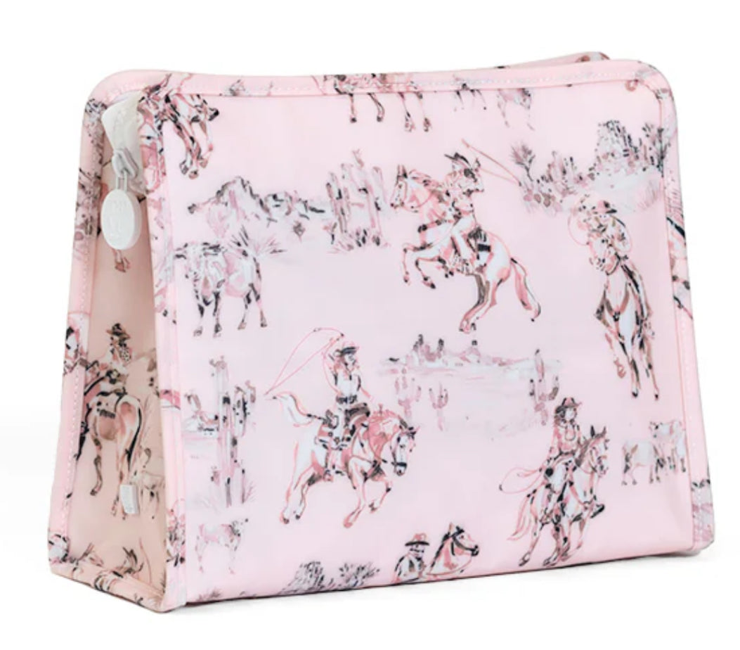 Pink cosmetic bag with cowgirl on horse pattern on a white background