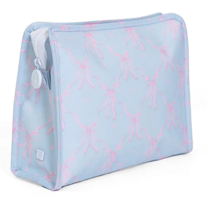 Light blue toiletry bag with pink bow pattern on a white background