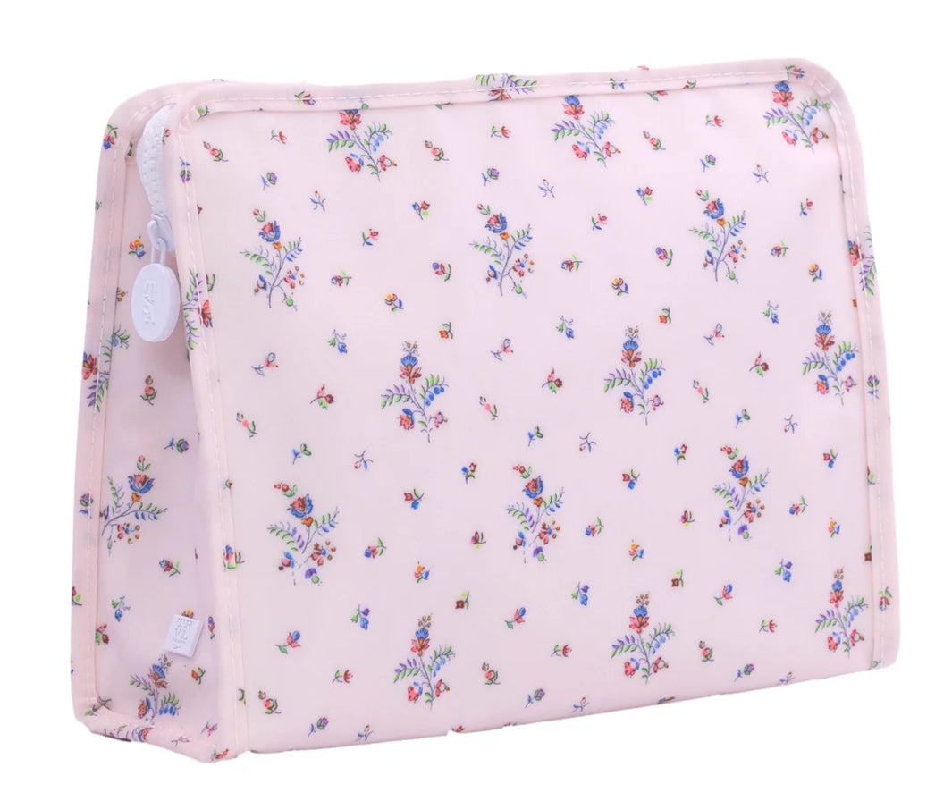 Floral-patterned pink pouch on a white background