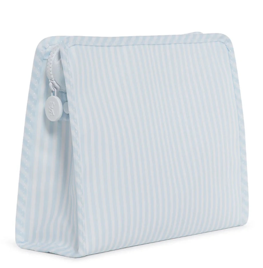 Light blue striped toiletry bag on a white background