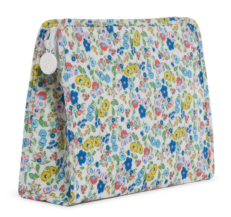 Floral patterned pouch with a white zipper on a white background