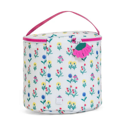 Floral-patterned bag with a pink handle on a white background