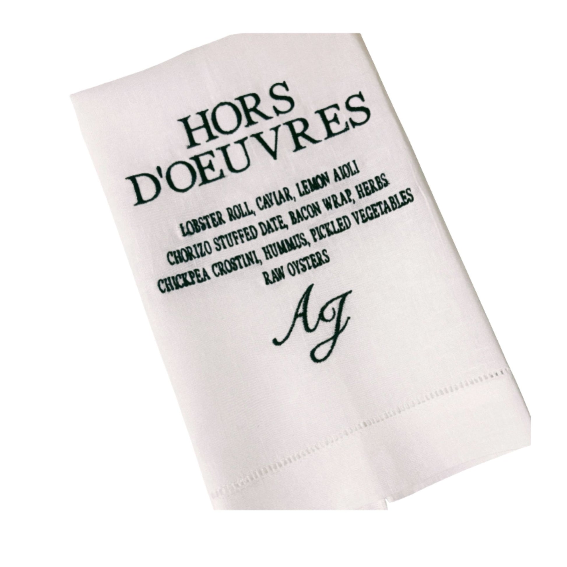 White napkin with black text and monogram on a white background
